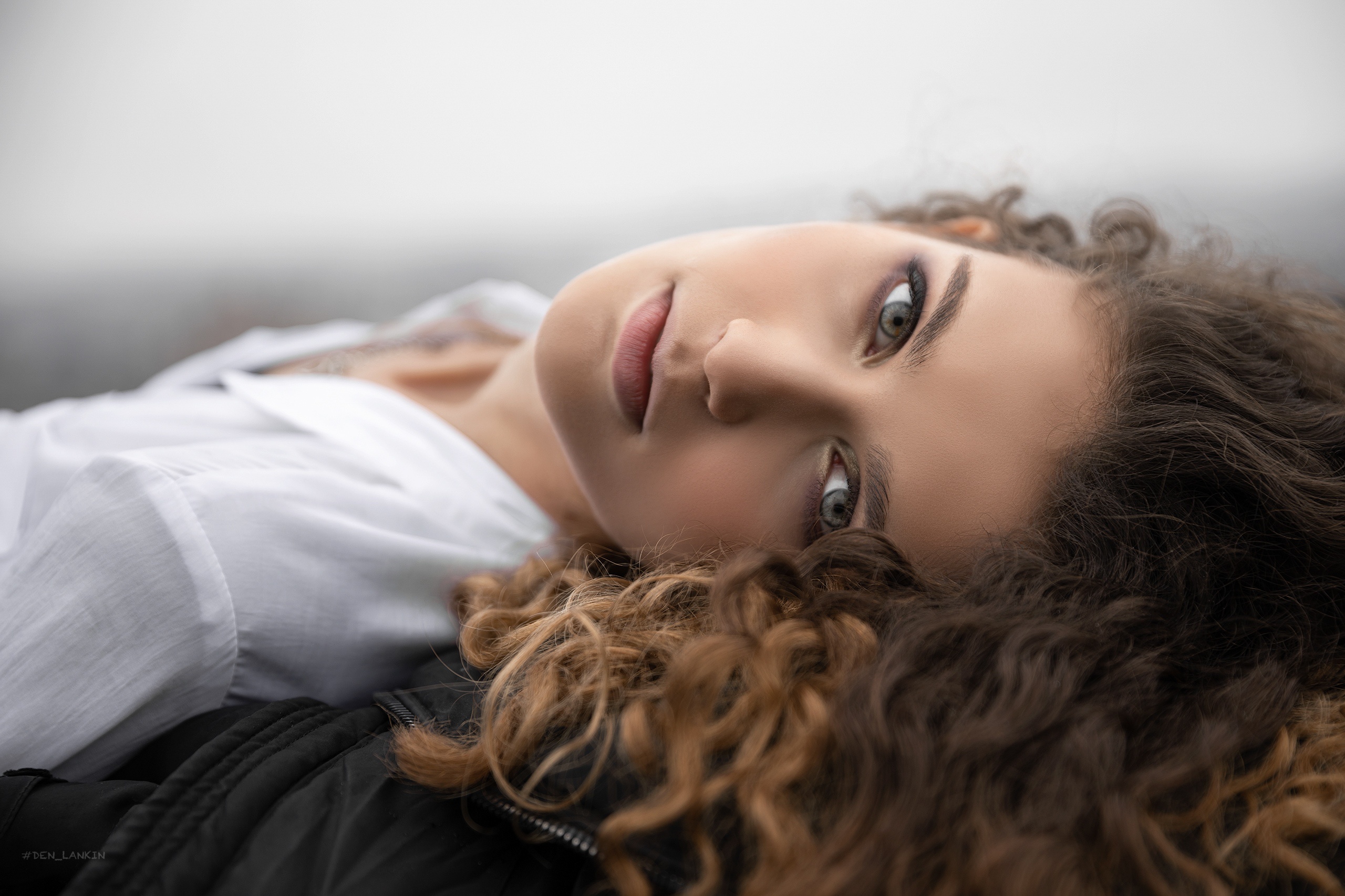 People 2560x1707 women model curly hair long hair face looking at viewer Denis Lankin white shirt depth of field dyed hair lying on back closeup