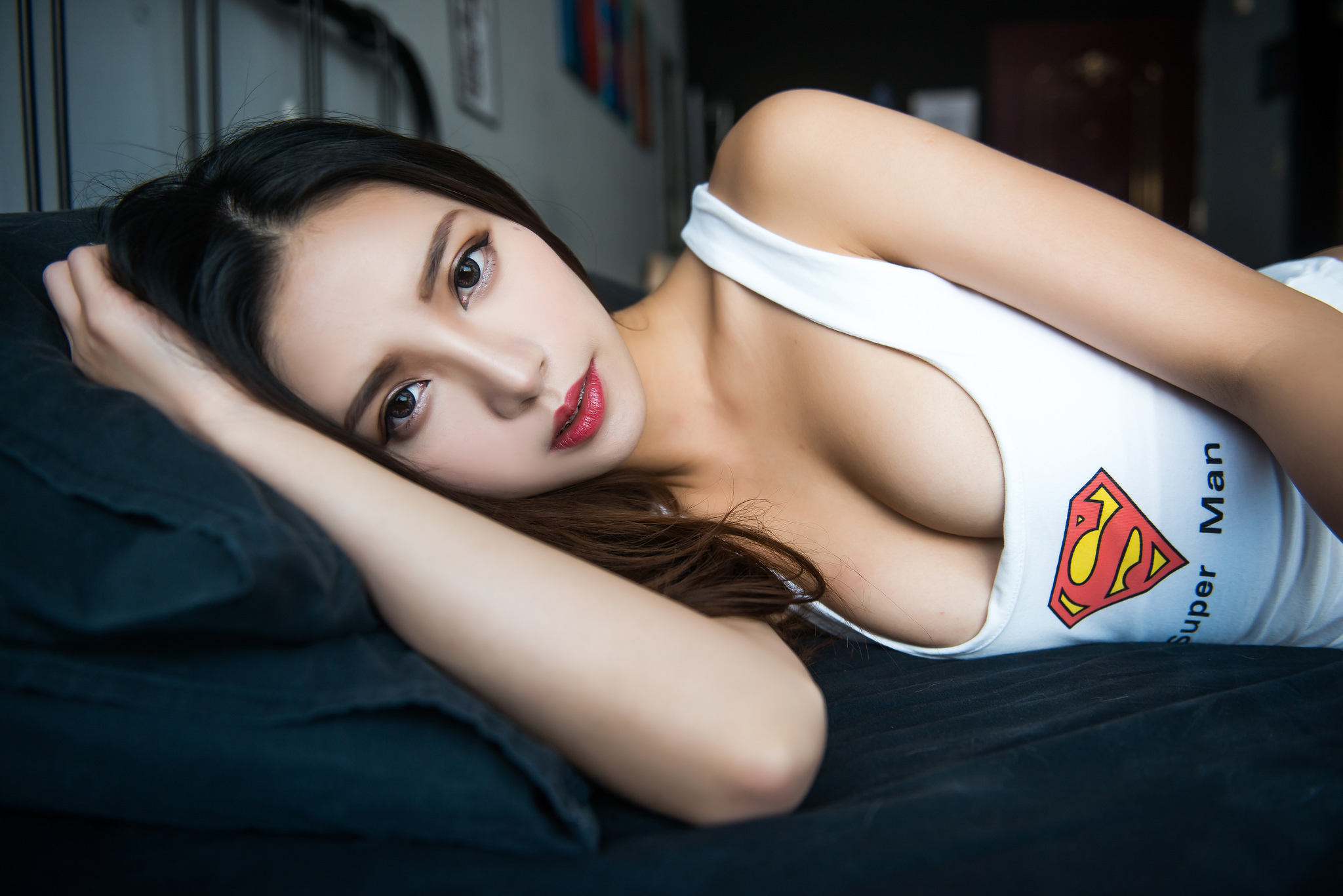 People 2048x1367 women Superman Asian cleavage black hair bed white tank top tank top Vivi Babier Chinese model Chinese superman logo