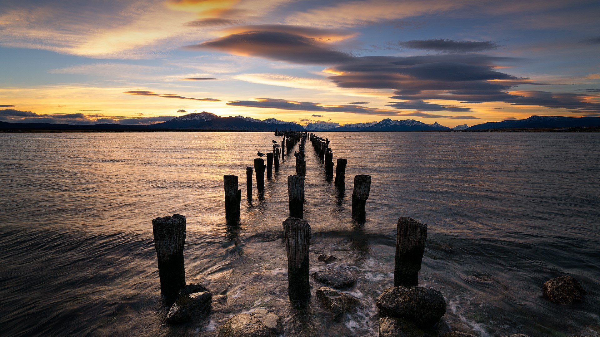 General 1920x1080 clouds sky mountains wood sunset water waves water ripples Puerto Natales Pier pier Chile landscape South America