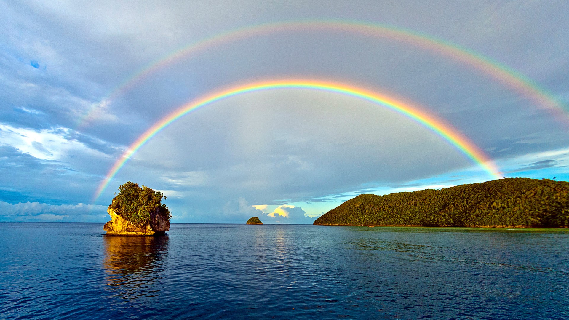 General 1920x1080 rainbows clouds sky horizon forest hills Indonesia Misool Island Raja Ampat