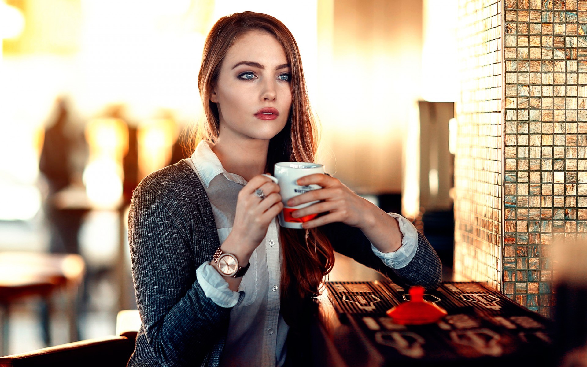 People 1920x1200 women model redhead long hair Alessandro Di Cicco cup looking away blouses sweater blue eyes open mouth depth of field restaurant sitting grey sweater mug open sweater white shirt cafeteria  April Slough coffee wristwatch women indoors indoors makeup red lipstick watch