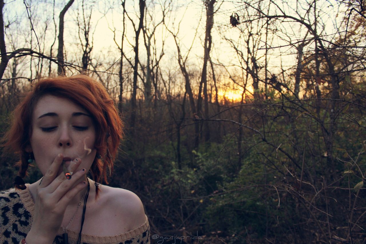 People 1280x853 women redhead forest smoking closed eyes joint drugs animal print outdoors trees women outdoors face watermarked model