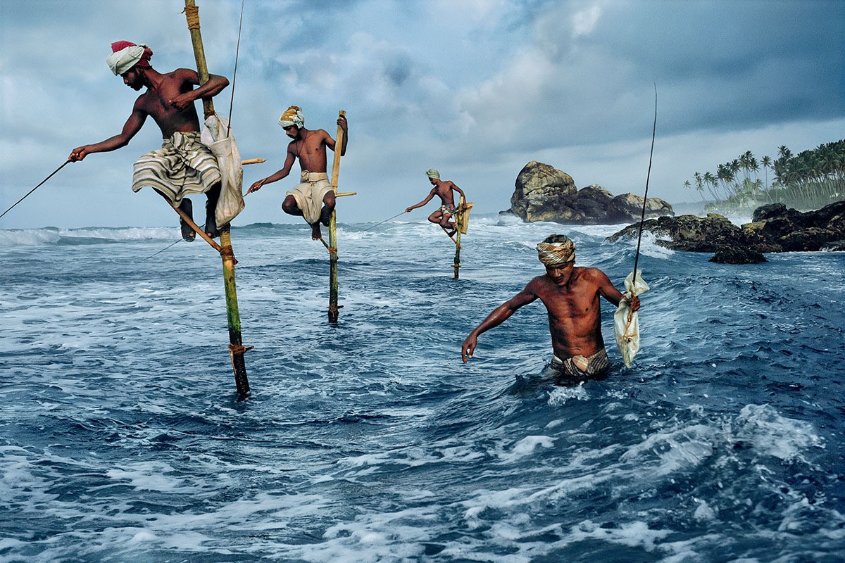 People 1200x800 photography fisherman sea bamboo rocks trees storm fishing India Steve McCurry men outdoors men