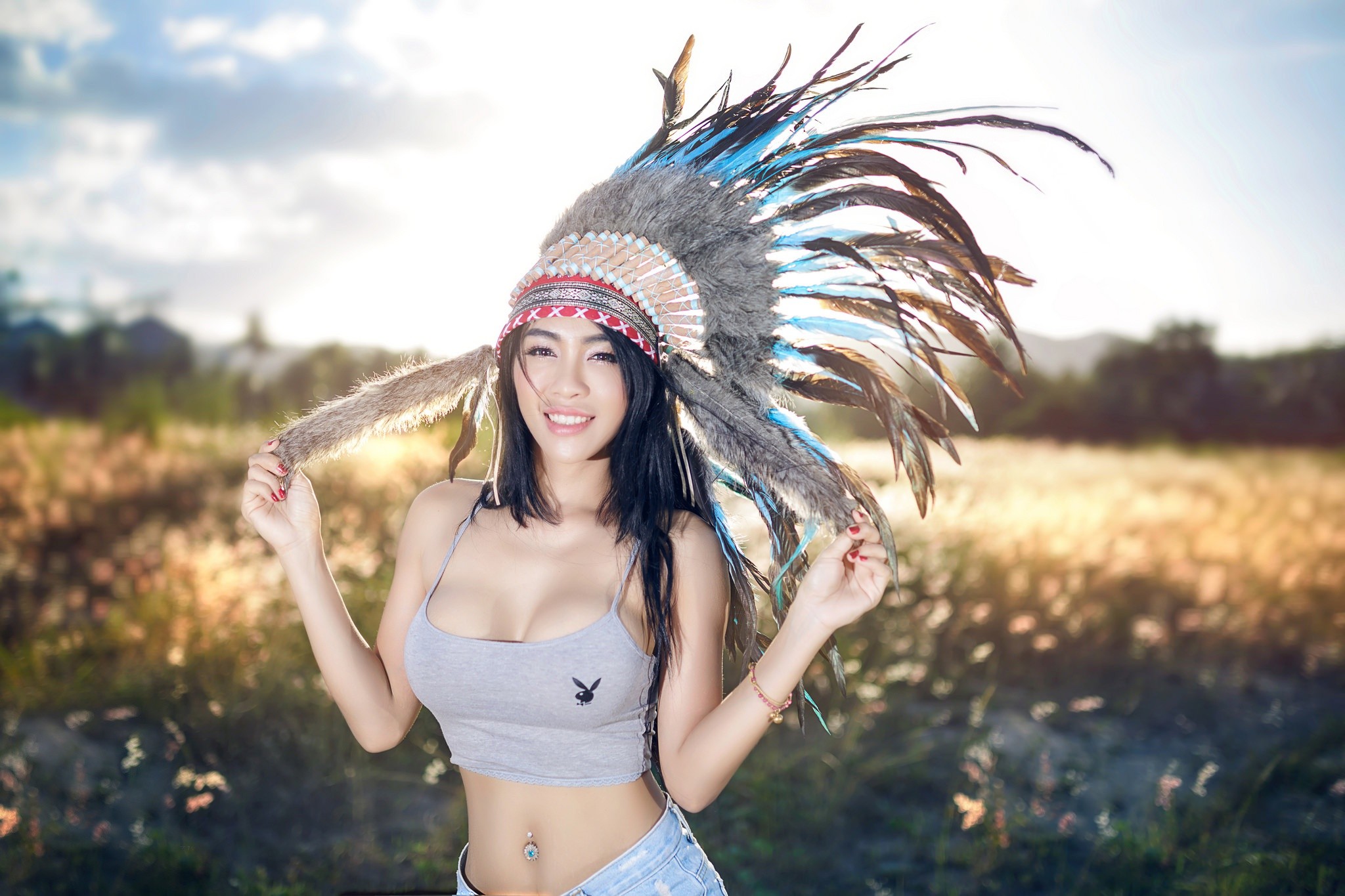 People 2048x1365 women feathers cleavage women outdoors field Native American clothing Native Americans smiling boobs dark hair painted nails pierced navel nature Asian Playboy