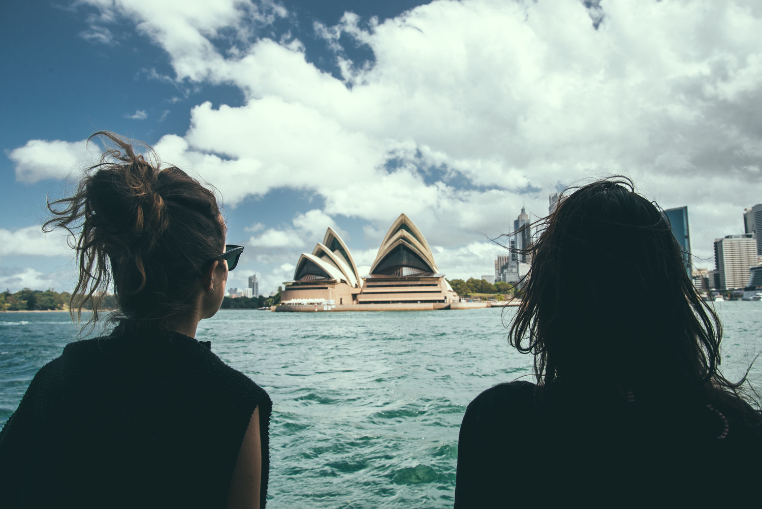 People 1500x1001 Noel Alvarenga photography women women outdoors brunette cityscape black clothing sea sky clouds back Sydney Opera House building women with shades