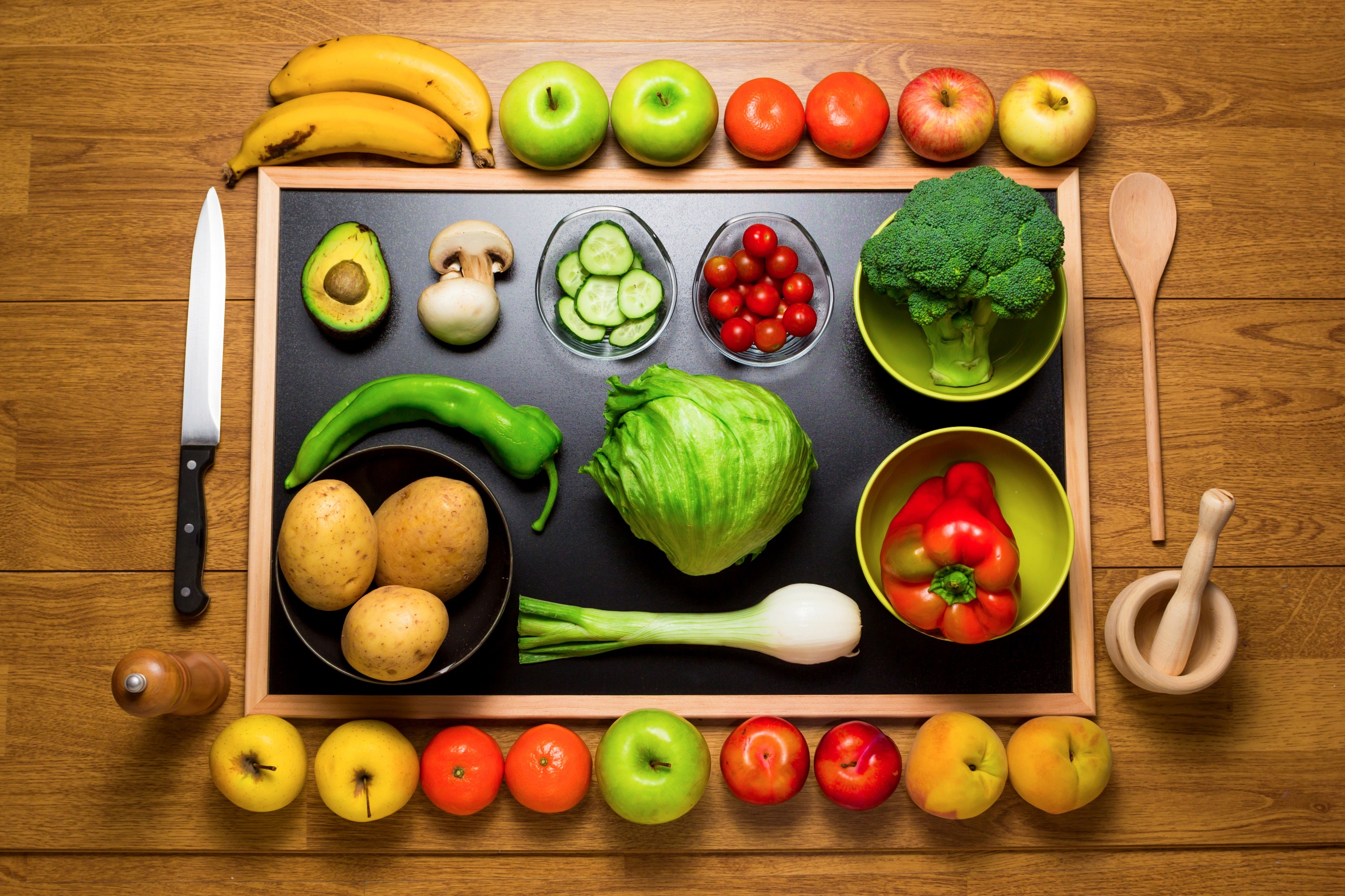 General 2560x1706 food vegetables knife fruit closeup top view potatoes apples orange (fruit) peaches bell peppers cabbage bananas pepper spoon tomatoes mushroom Avocado wooden spoon wooden surface onion