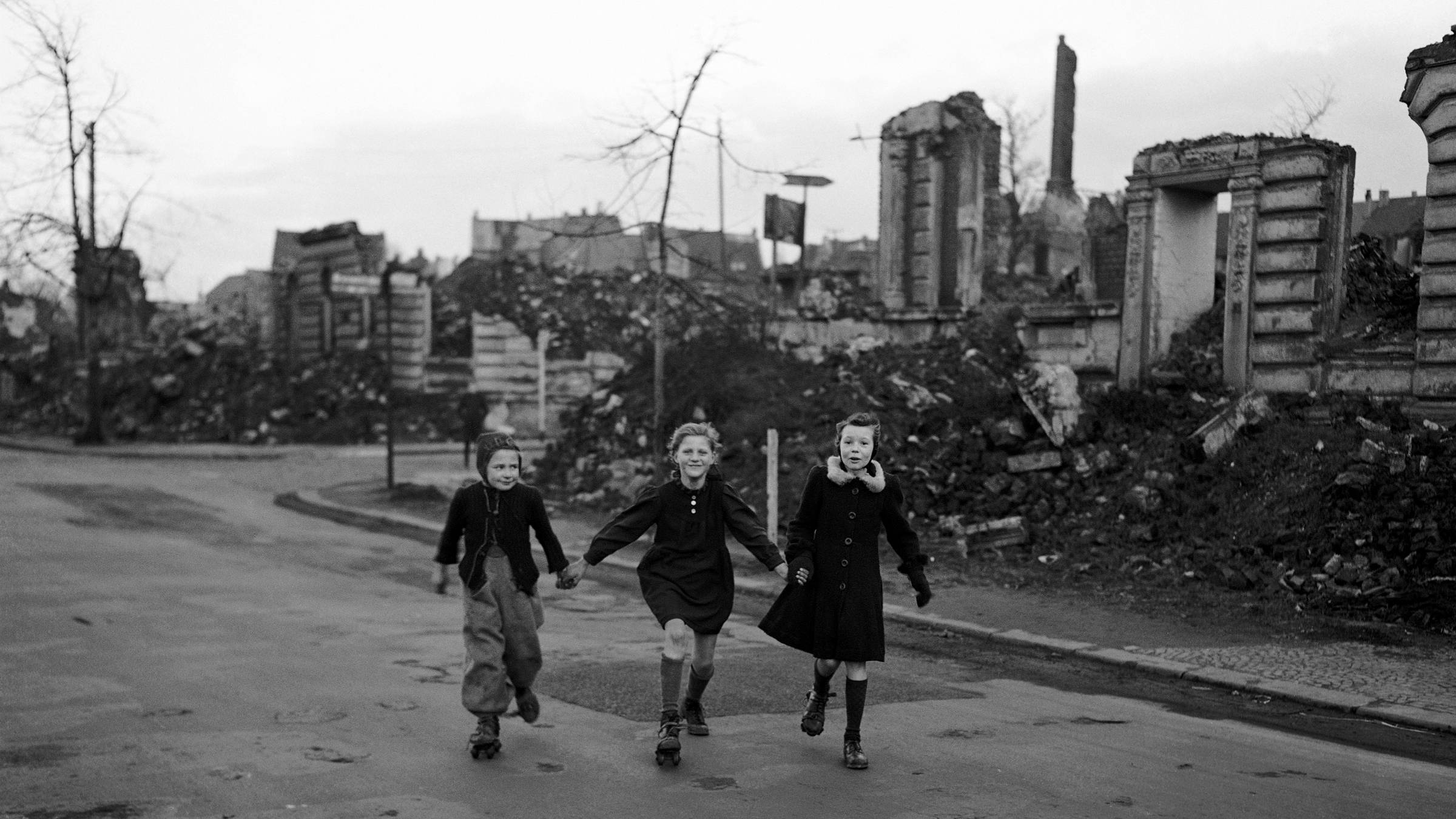 People 2400x1350 Germany World War II war children monochrome rubble roller skates