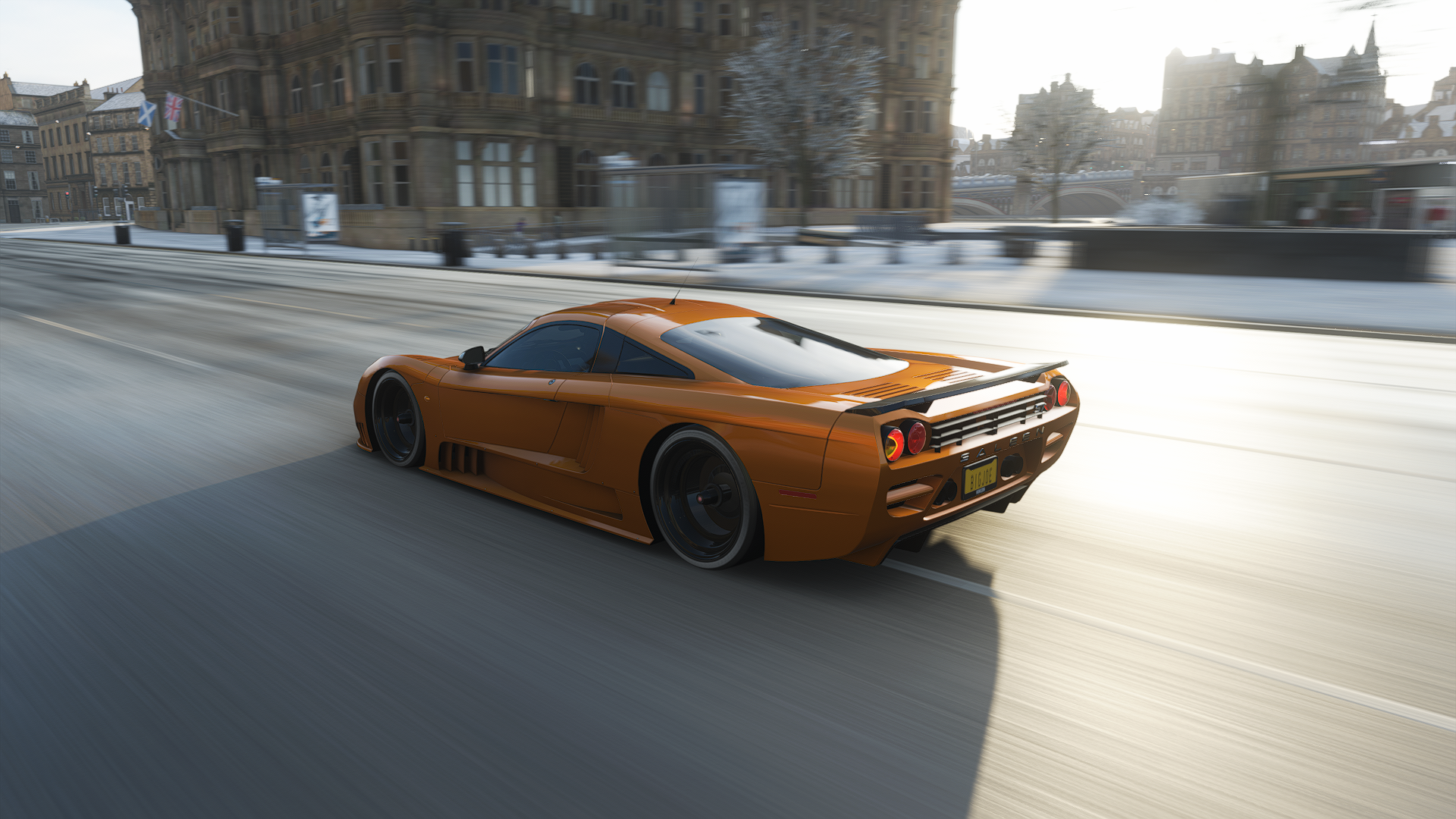 General 1920x1080 Forza Horizon 4 Forza Horizon Forza driving CGI car supercars Saleen S7 video games vehicle rear view taillights building trees flag road blurry background blurred sunlight