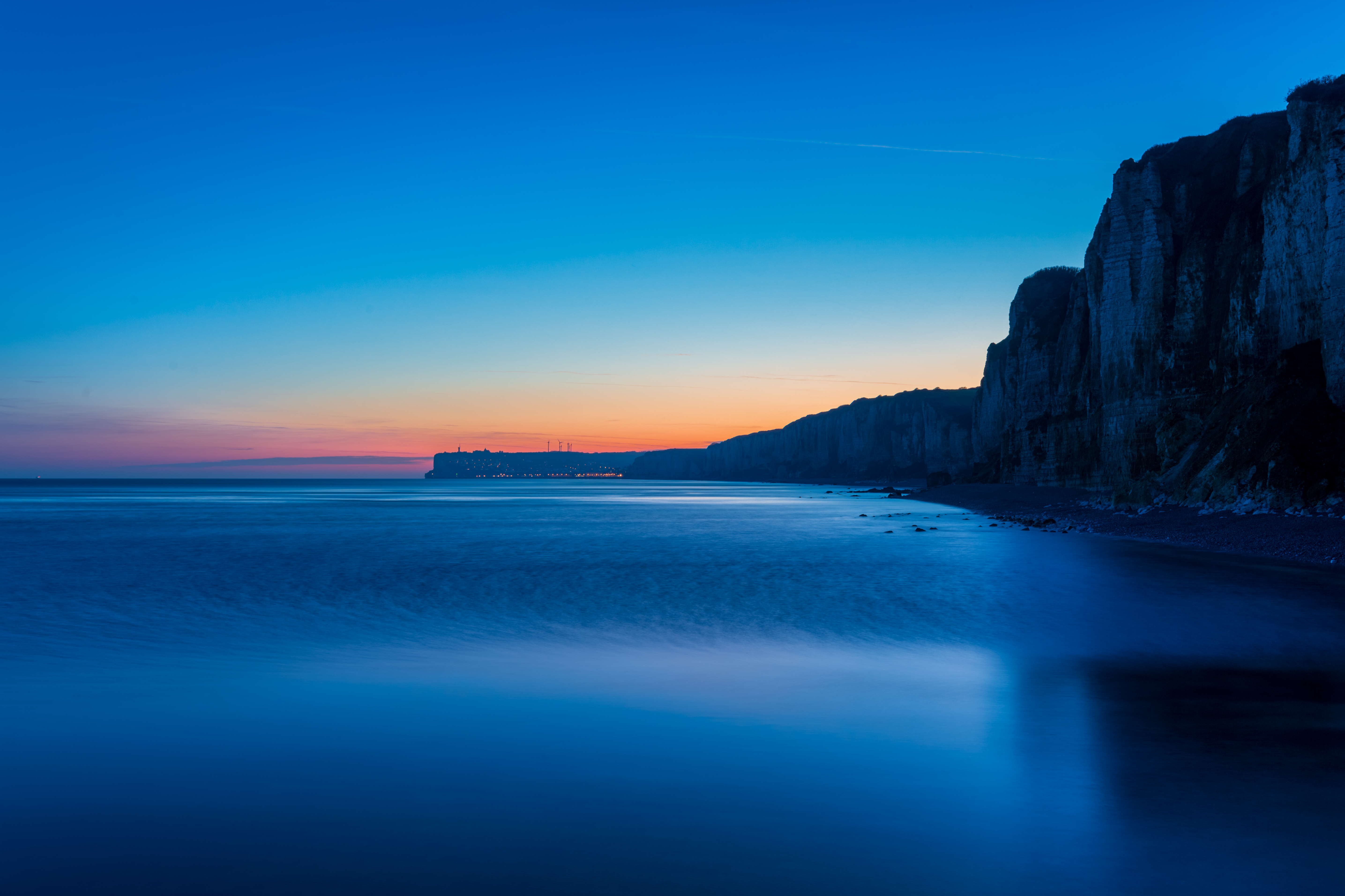 General 5740x3827 sunset sea blue photography peaceful cliff simple background France sunset glow skyscape sunlight water sky city wind turbine city lights