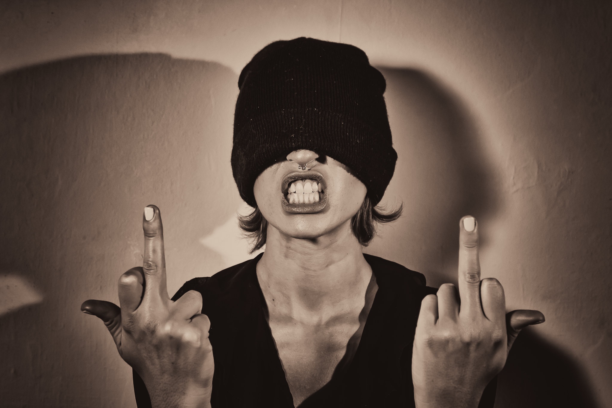 People 2048x1365 women angry face middle finger hand gesture teeth open mouth brunette wool cap covered eye(s) sepia monochrome closeup simple background