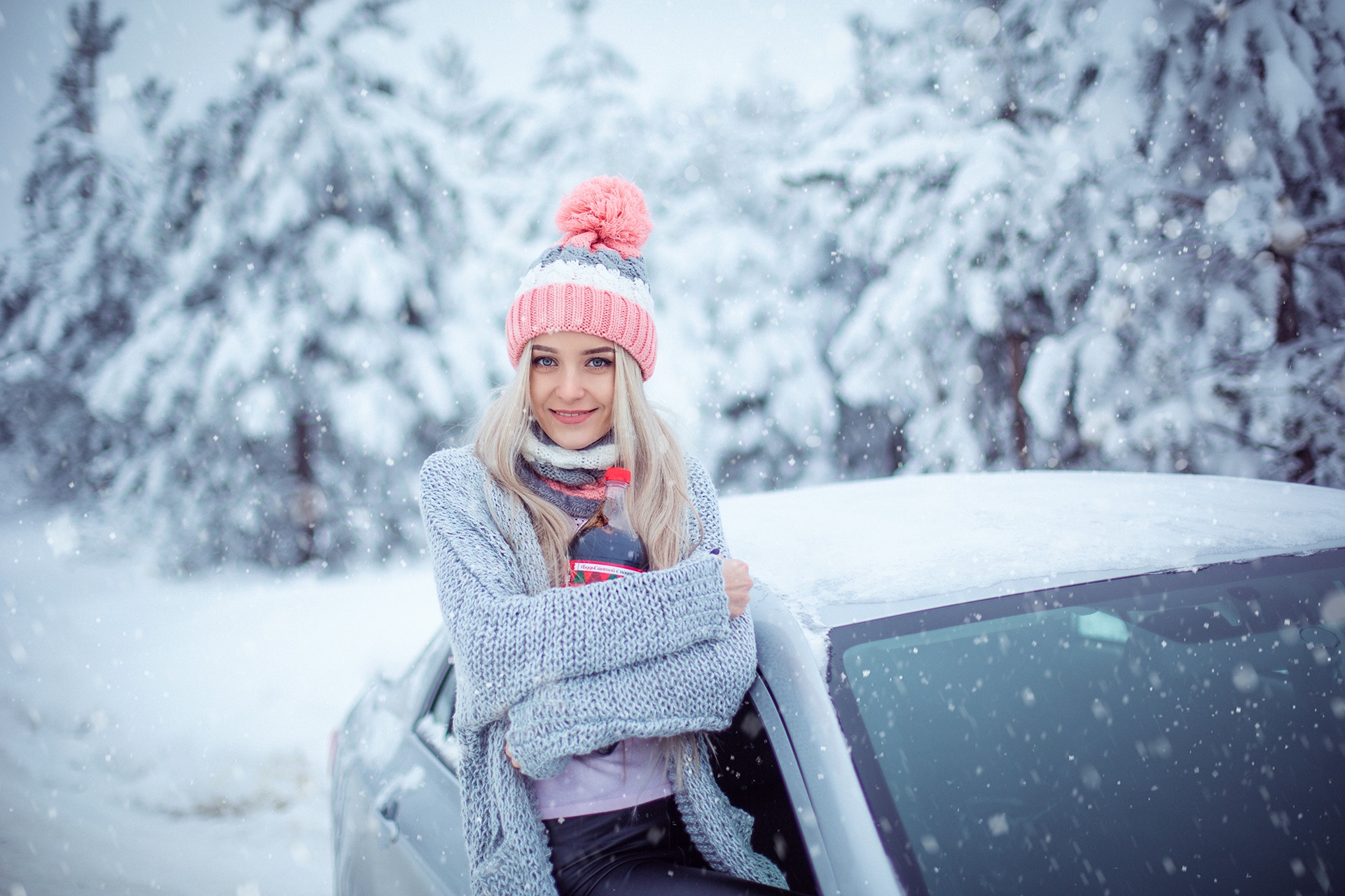 People 1920x1280 Sergey Shatskov women snow women outdoors blonde women with cars hat cold car smiling wool cap sweater snowing winter open sweater leather pants  black pants platinum blonde
