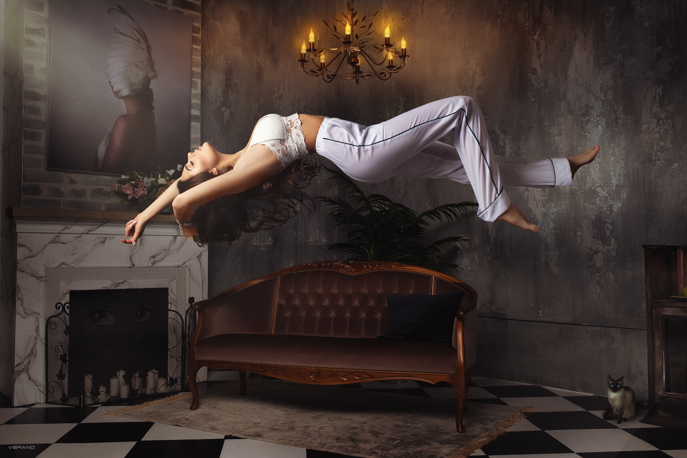 People 2360x1575 women indoors floating arched back brunette closed eyes loveseat chandeliers Siamese cats white tops arms up Nikolas Verano checkered bra indoors model pants photo manipulation Anastasia Leonova floor
