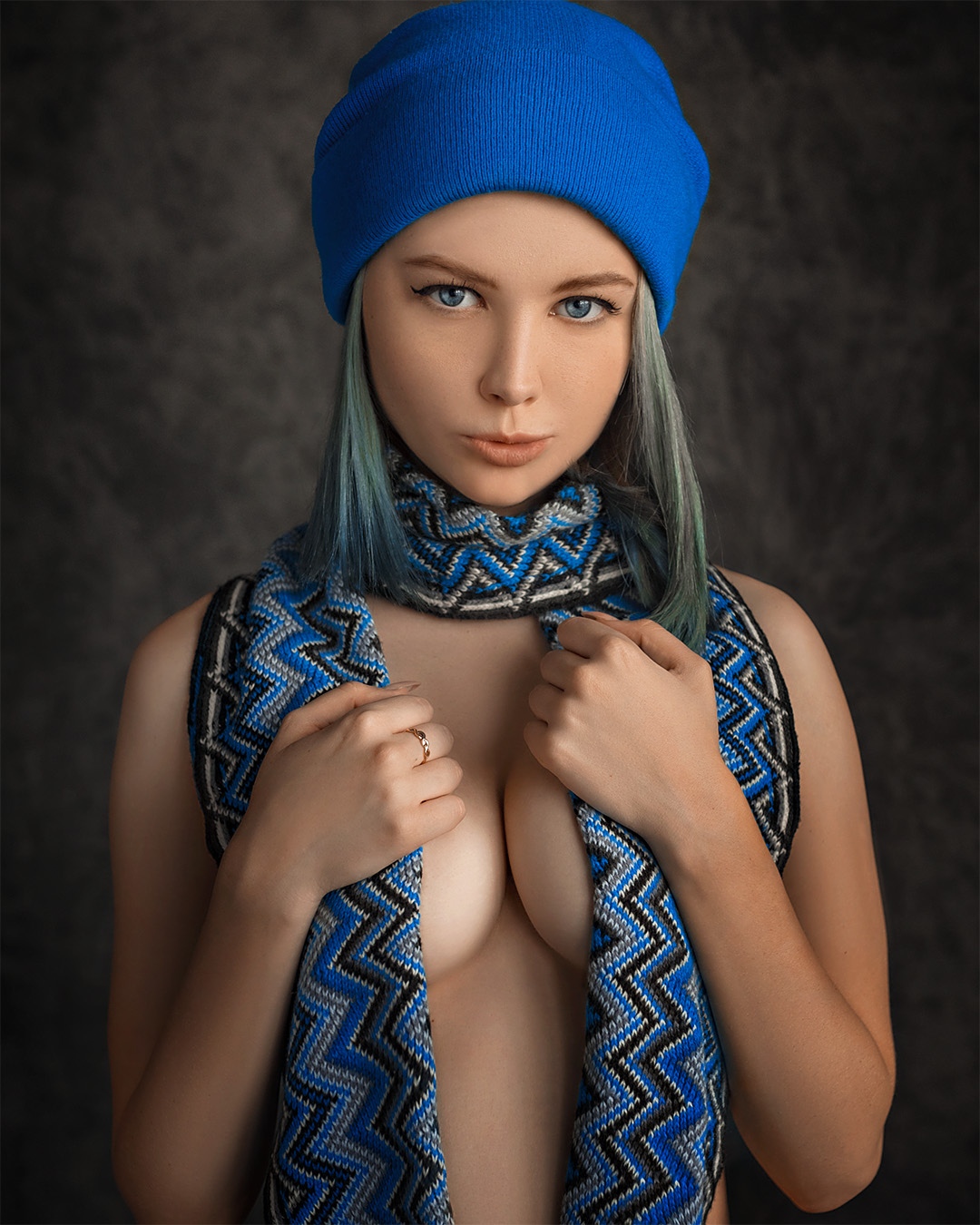 People 1080x1350 Evgeny Sibiraev women Alexandra Bessonova hat straight hair shoulder length hair blue hair dyed hair blue eyes looking at viewer scarf nude strategic covering simple background eyeliner frontal view portrait portrait display beanie