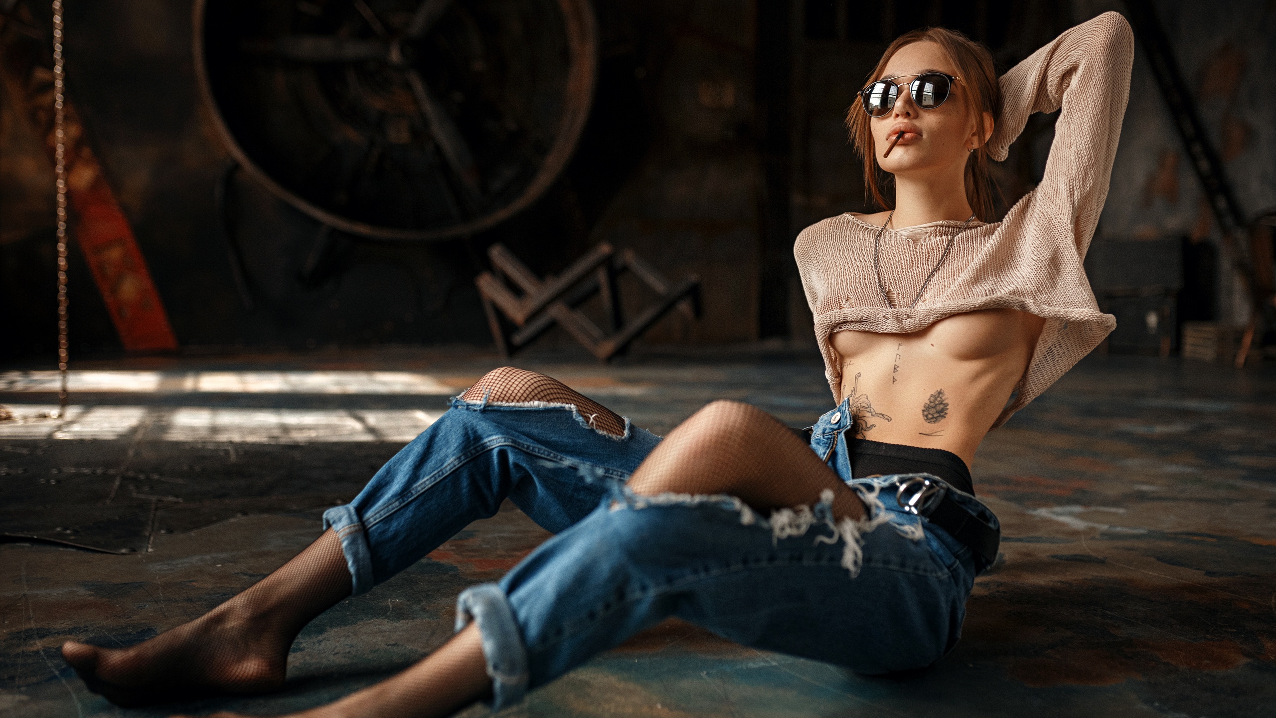 People 2560x1440 Anastasia Zakieva women model brunette women with shades juicy lips sunglasses cigarettes necklace sweater knit fabric crop top no bra underboob belt jeans torn jeans torn clothes fishnet pantyhose sitting bokeh tattoo inked girls indoors women indoors smoking barefoot