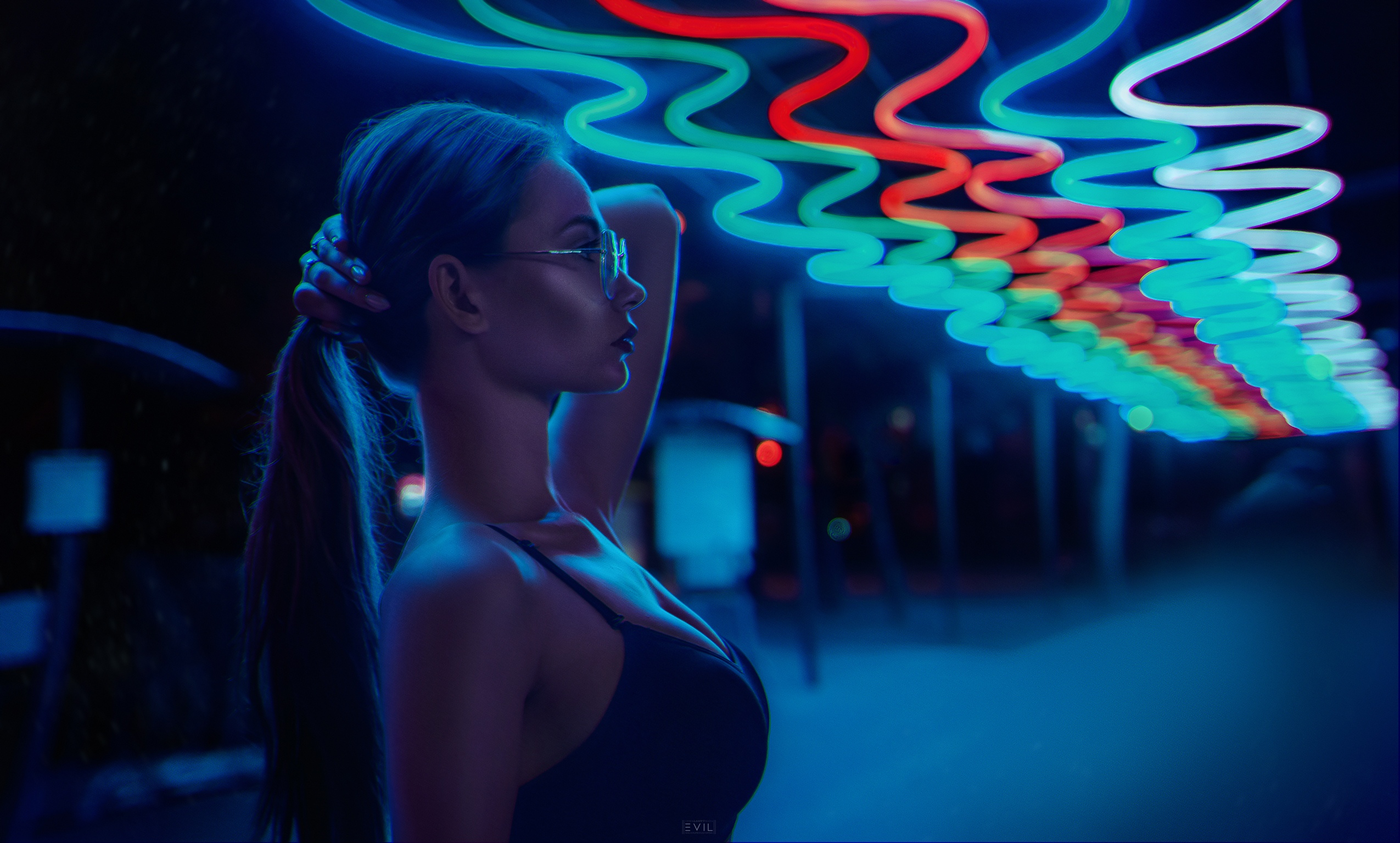 People 2550x1535 women model brunette long hair ponytail holding hair profile women with glasses cleavage black top side view depth of field neon dark outdoors blue