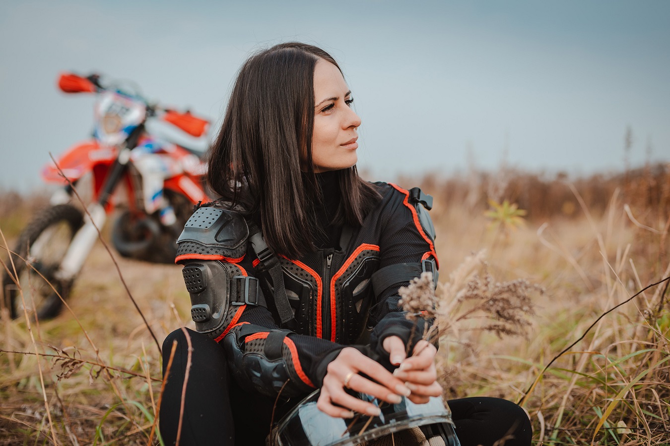 People 1350x900 women motorcycle outdoors brunette shoulder length hair women with motorcycles grass looking away straight hair zipper sitting on the ground