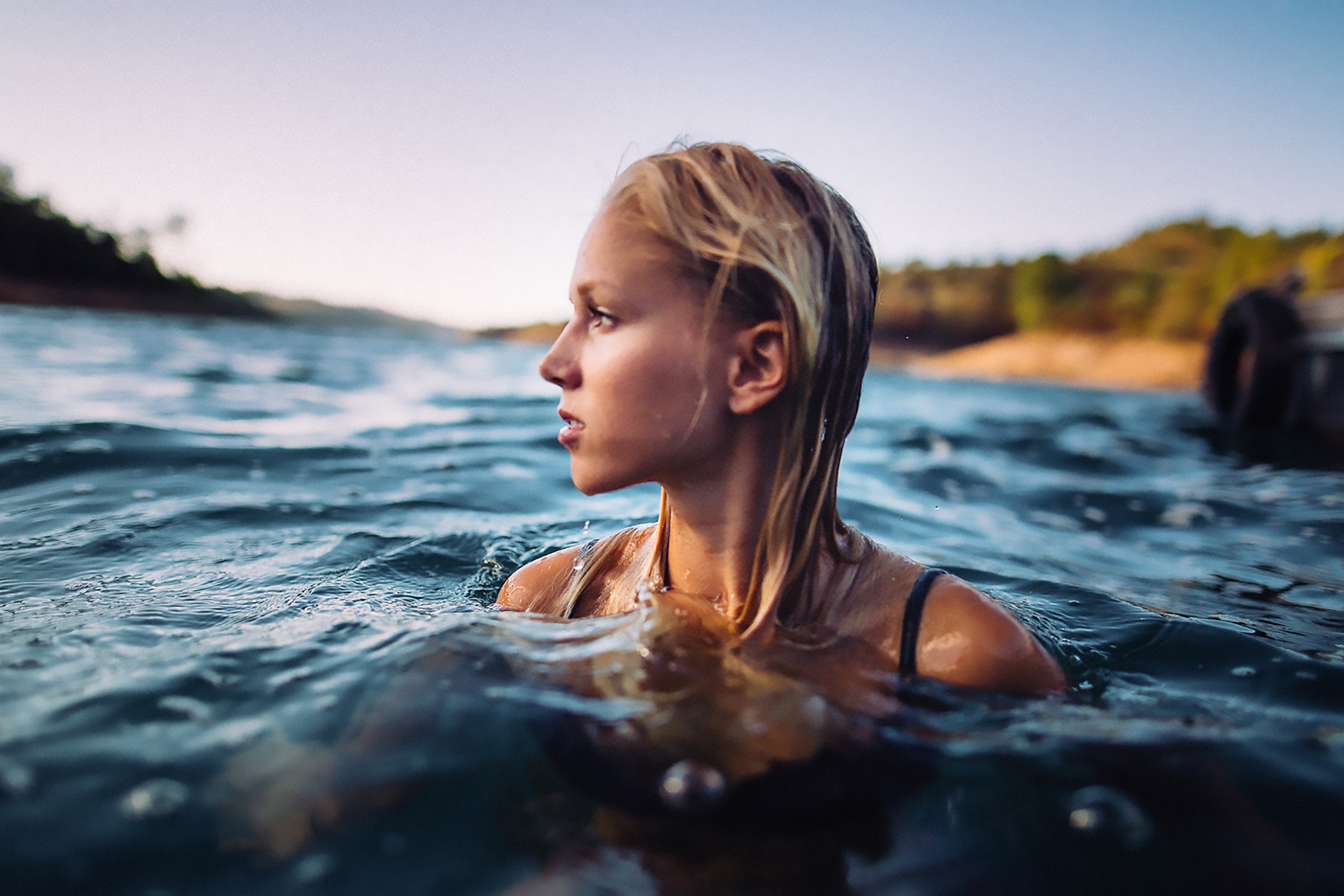 Woman with blue hair swimming in water - wide 3