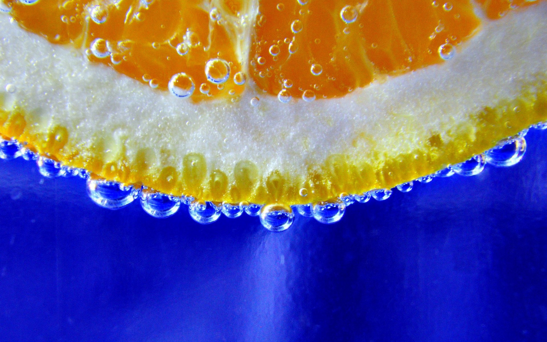General 1920x1200 minimalism underwater bubbles water fruit orange (fruit) blue background closeup water drops blue food