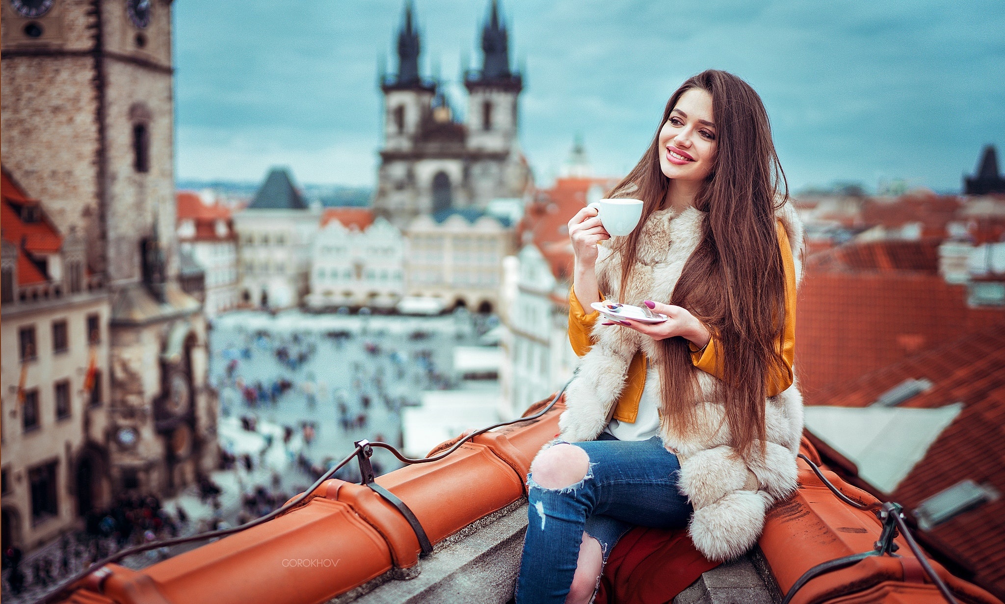 People 2048x1231 rooftops cup long hair women outdoors cityscape women torn jeans smiling Ivan Gorokhov Prague Czech Republic orange jacket straight hair looking into the distance fur looking away torn clothes jacket Church of Our Lady before Týn