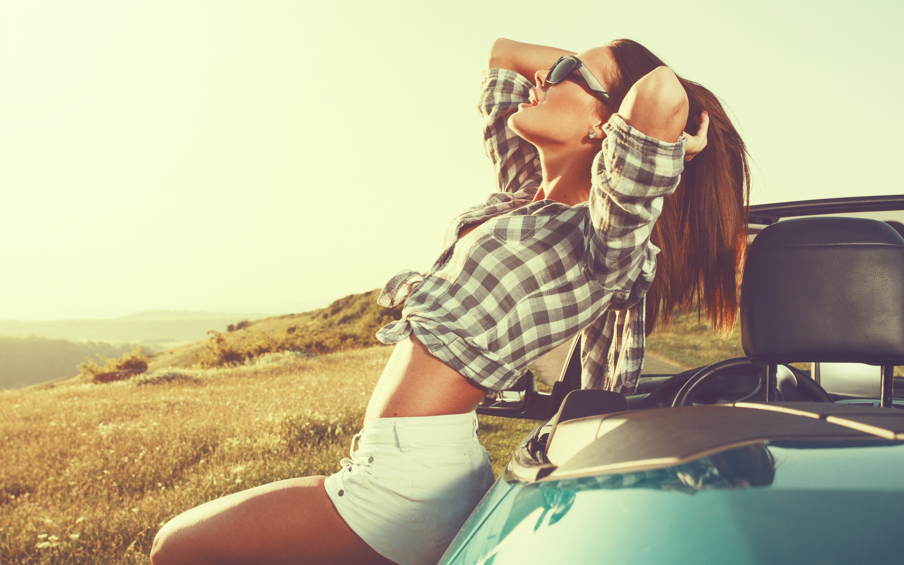 People 2880x1800 women model long hair women outdoors nature sunglasses checkered shirt belly shorts sunlight car cabrio open mouth field redhead hands in hair side view profile thighs