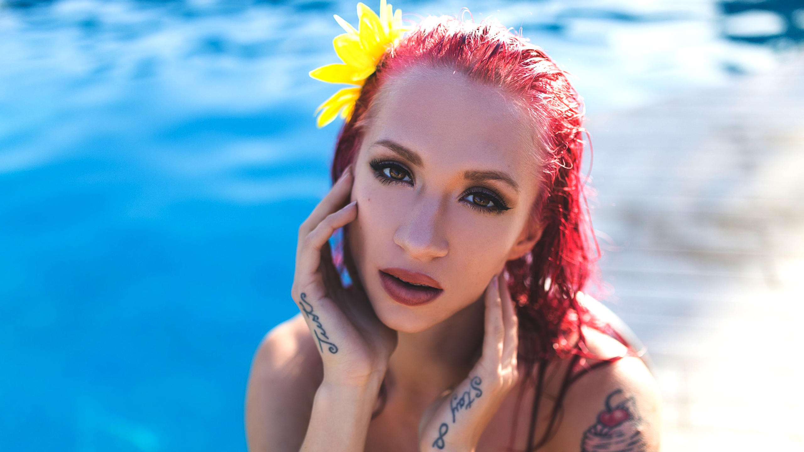People 2560x1440 Natasha Legeyda Suicide Girls big boobs swimming pool women face closeup water flower in hair dyed hair tattoo juicy lips moles redhead
