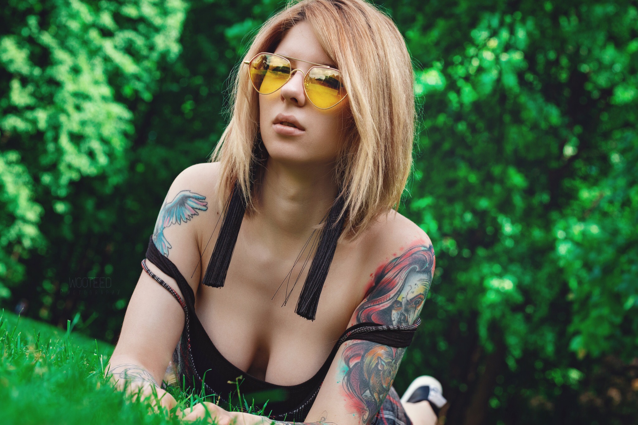 People 2048x1365 women model looking at viewer inked girls tattoo women outdoors trees depth of field women with shades lying on front cleavage grass Nastya Bajman