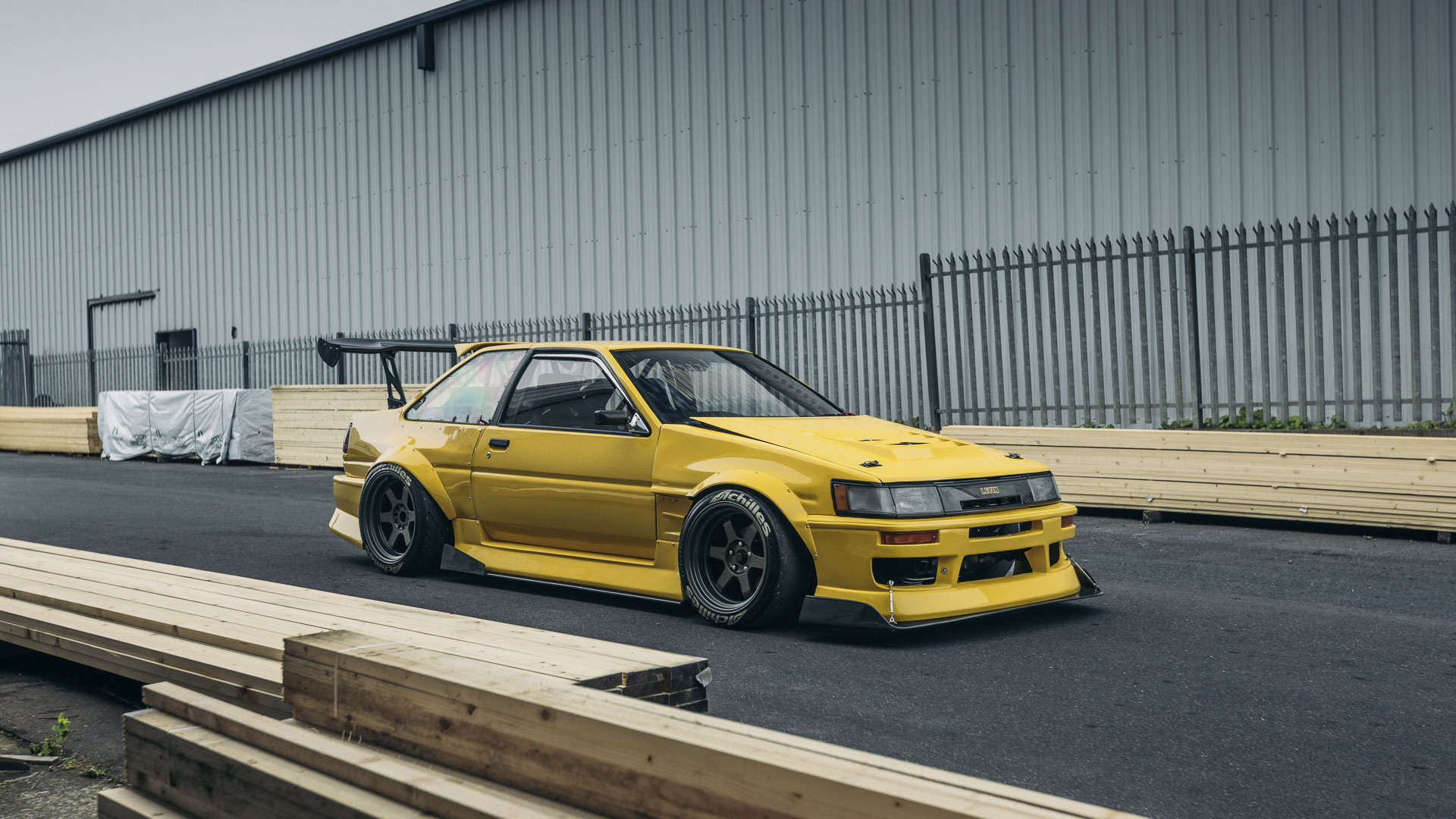 General 1920x1080 Toyota Toyota AE86 car yellow cars vehicle frontal view bodykit Japanese cars car spoiler