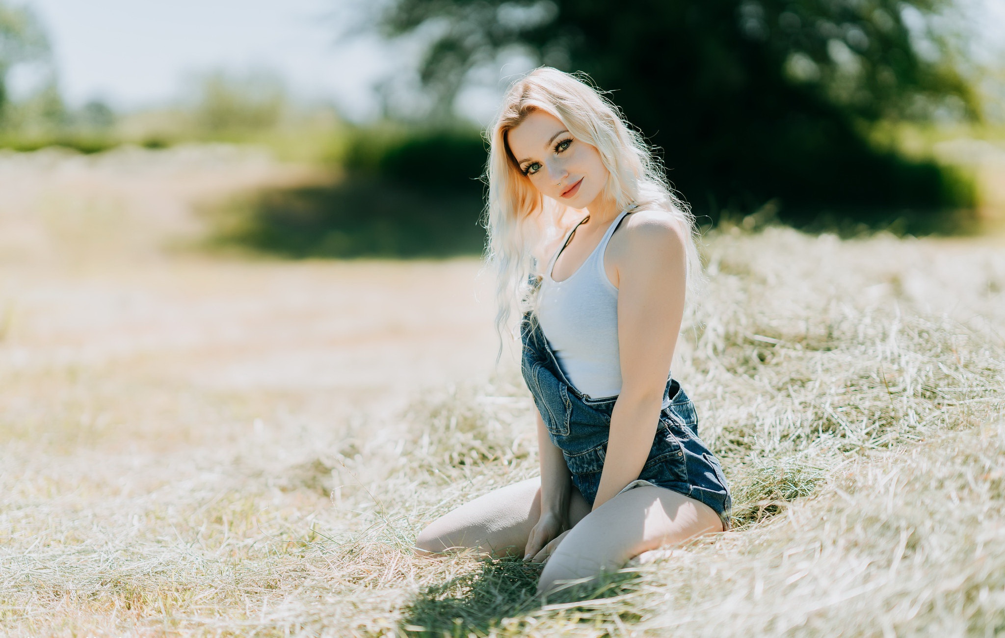 People 2048x1300 model women blonde blue eyes mouth lips tank top white tops overalls legs kneeling looking at viewer portrait