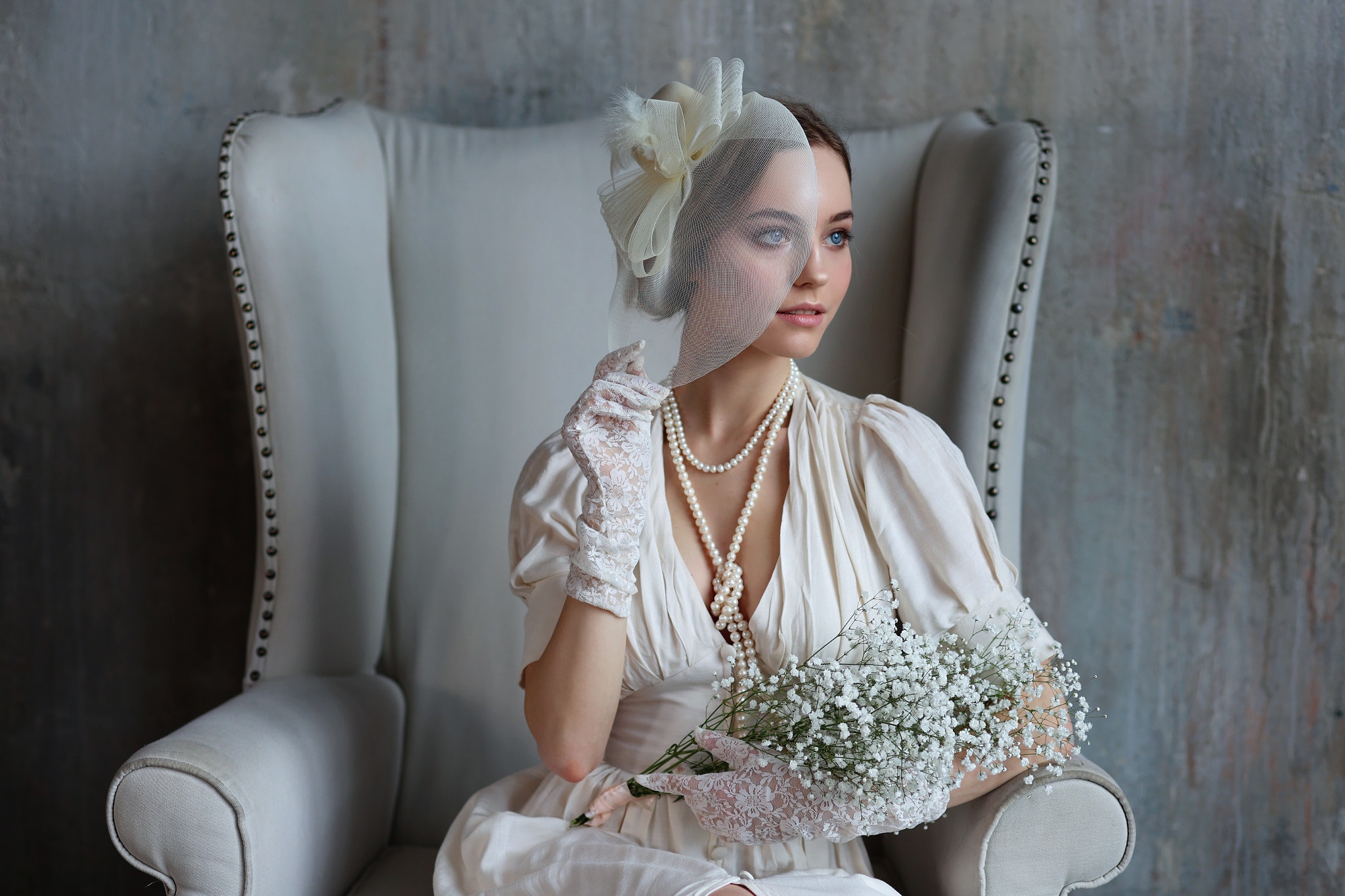 People 2048x1365 model red lipstick necklace white clothing blue eyes gloves sitting on chair women brunette veils pearl necklace lace gloves flowers white dress sitting chair women indoors