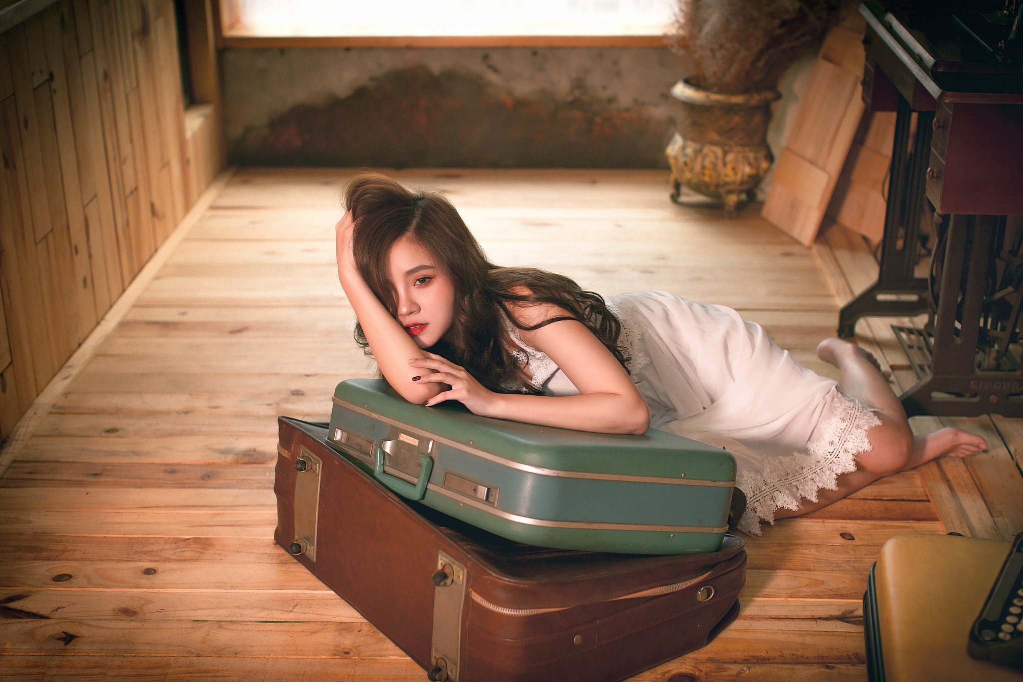 People 2048x1365 model red lipstick Asian hands in hair white clothing long hair lying on front suitcase women brunette women indoors