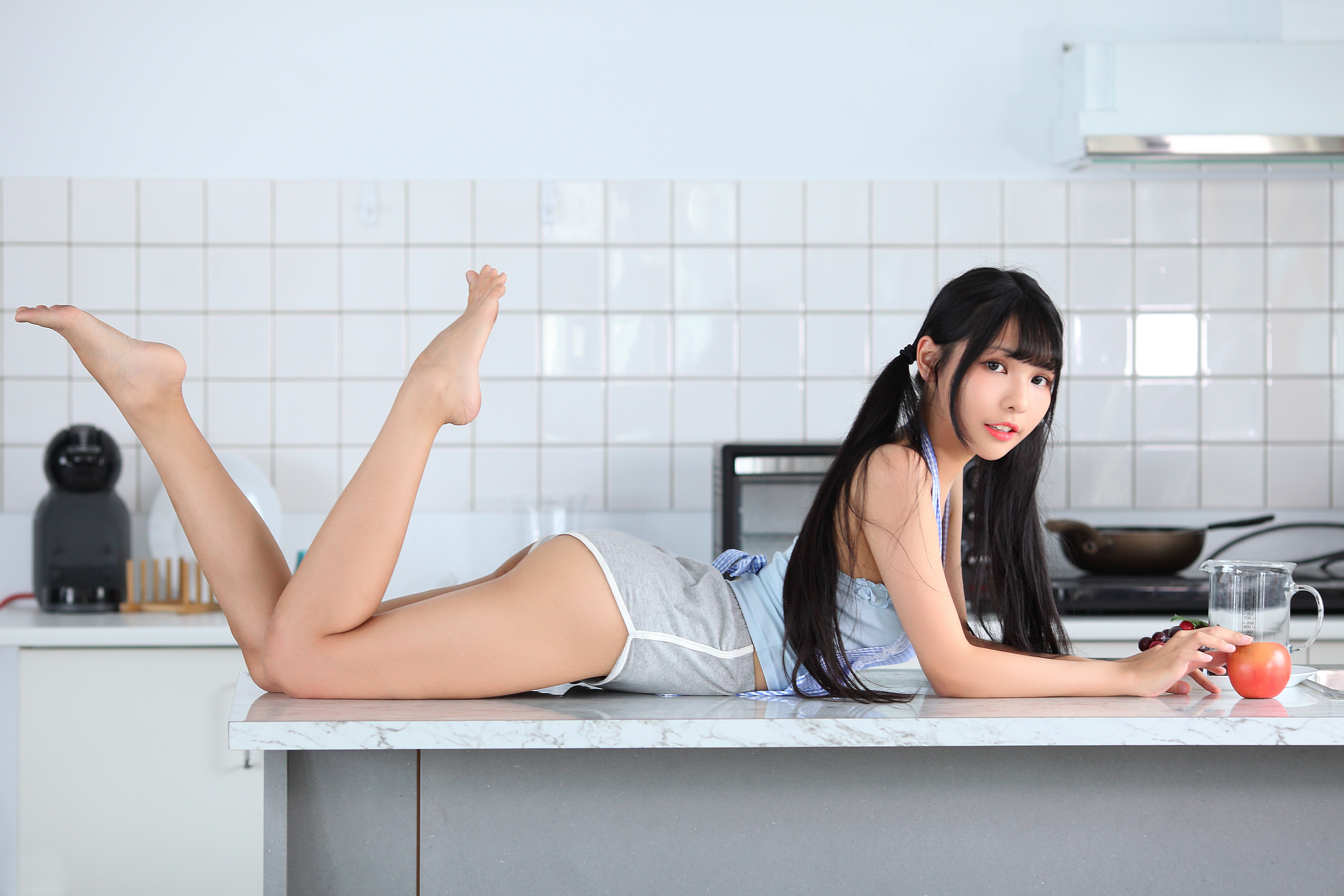 People 3840x2560 Asian women model long hair dark hair Vicky (Asian model) feet in the air legs pointed toes barefoot ass arched back on table black hair twintails red lipstick fruit kitchen women indoors indoors looking at viewer lying on front feet