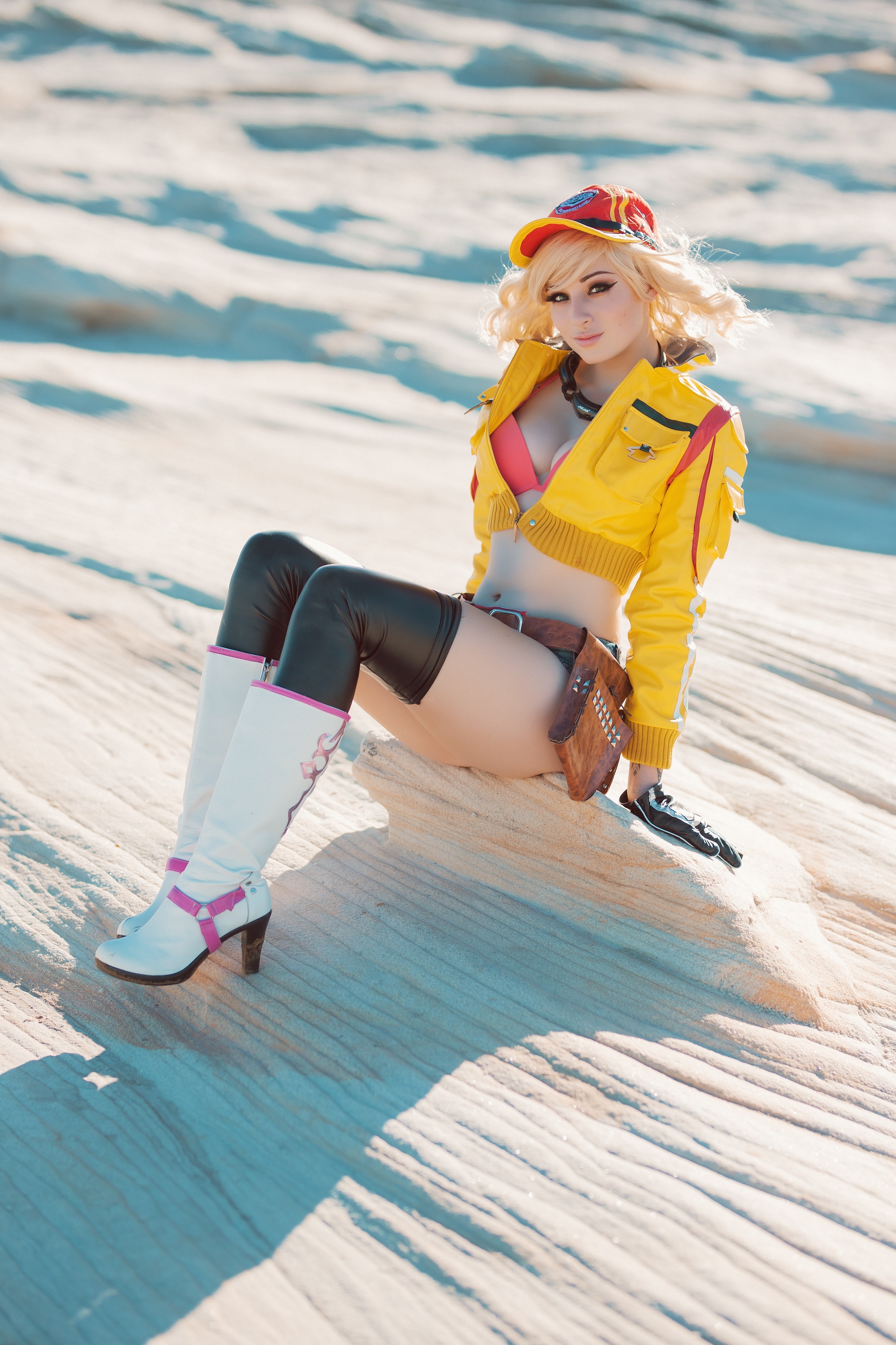 People 2000x3000 Kayla Erin women model blonde outdoors portrait display cosplay Final Fantasy XV Final Fantasy knee-highs thigh-highs boots baseball cap jacket yellow jacket gloves belly jean shorts high waisted shorts belt cleavage bra looking at viewer sitting goggles Beethy women outdoors depth of field Cindy Aurum