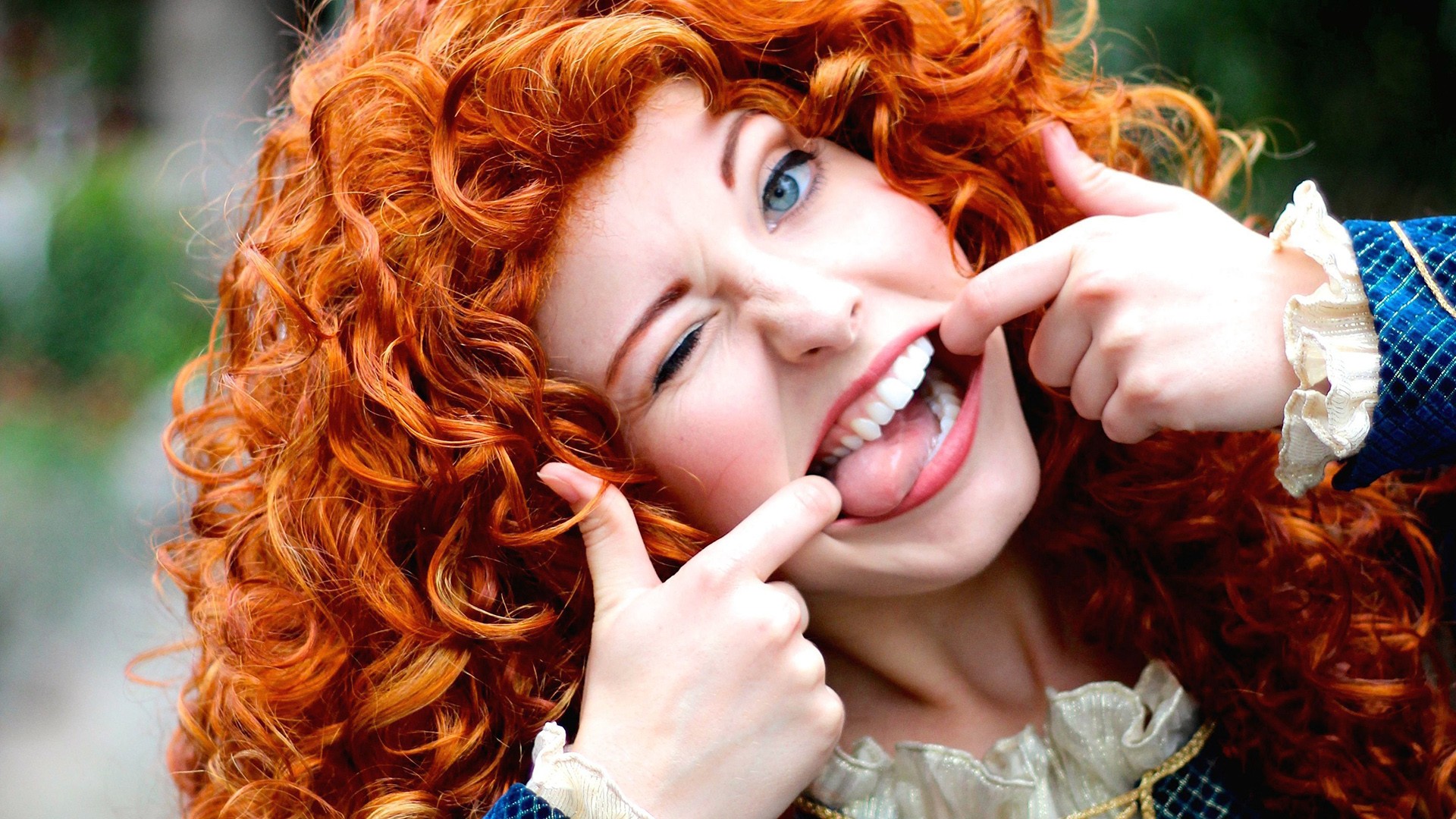 People 1920x1080 women redhead blue eyes cosplay Brave humor curly hair wink tongues wacky face closeup looking at viewer dyed hair one eye closed