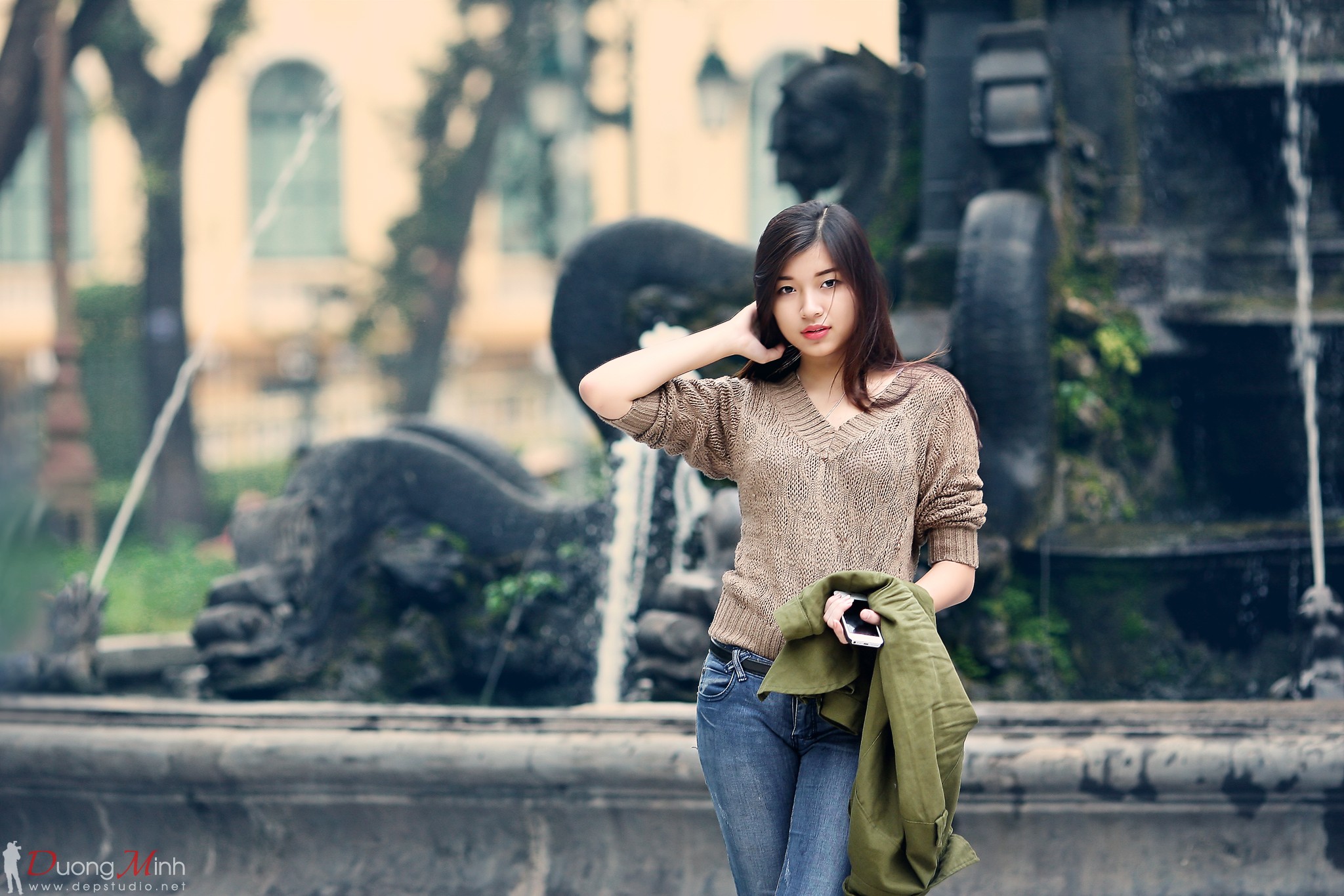 People 2048x1365 jeans women outdoors depth of field hands in hair looking at viewer brunette pullover portrait women fountain sweater standing Asian model watermarked