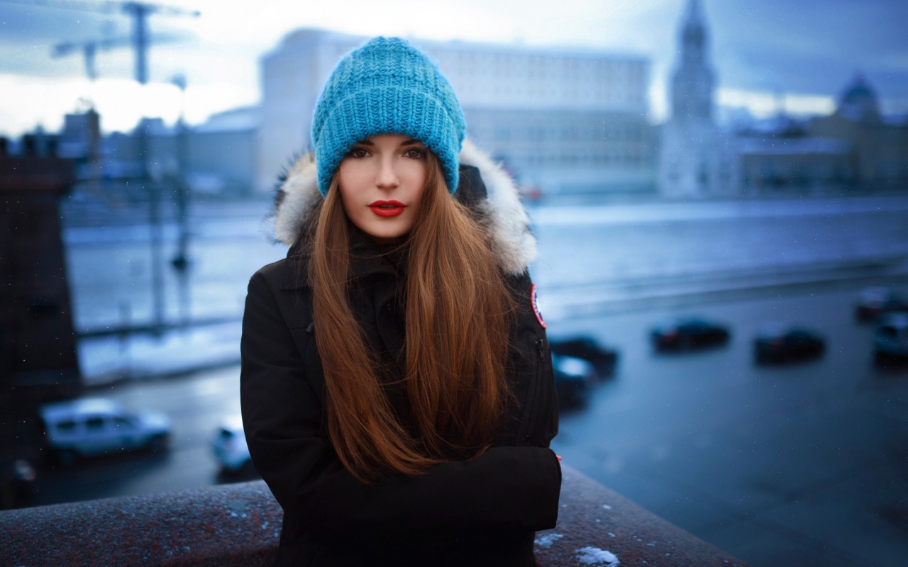 People 1280x800 women model Sasha Spilberg black jackets brunette long hair red lipstick wool cap straight hair brown eyes blue cap women outdoors hat women with hats cold makeup looking at viewer