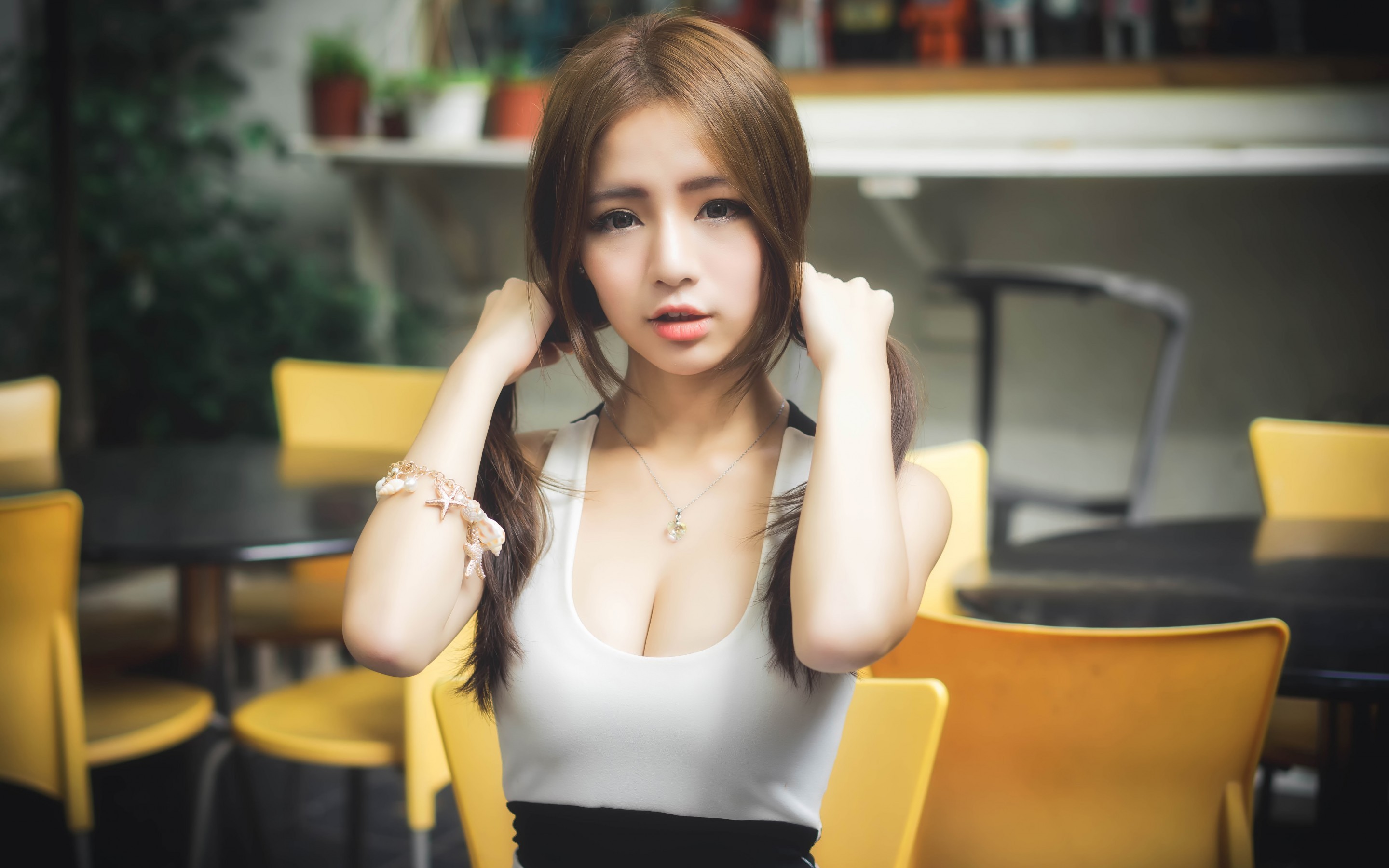 People 2880x1800 women model Asian cleavage looking at viewer long hair dress depth of field auburn hair face holding hair necklace brunette women indoors indoors bracelets